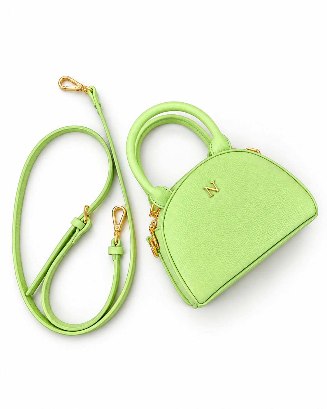 NORIVE Garden lime green mini handbag with textured exterior, gold-tone logo, rounded handles, and matching detachable crossbody strap.